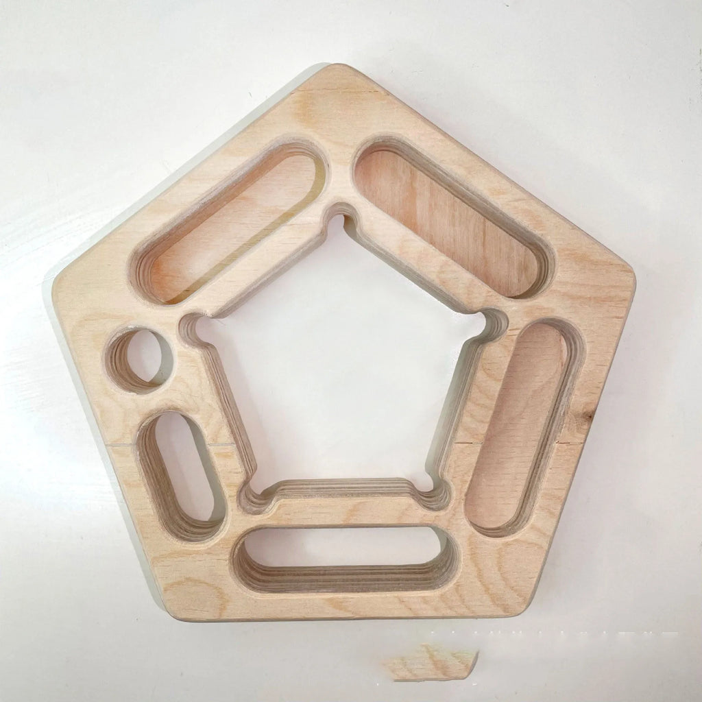 Birch wooden pentagonal-round climbing finger force training plate on a neutral background.
