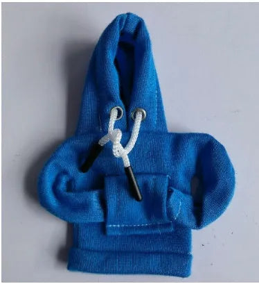 Blue cloth cover fitted over a car gear shift knob showing sewing detail