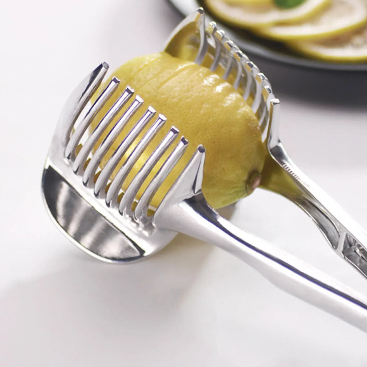 Silver plastic lemon slicer kitchen gadget for fruit and vegetable cutting