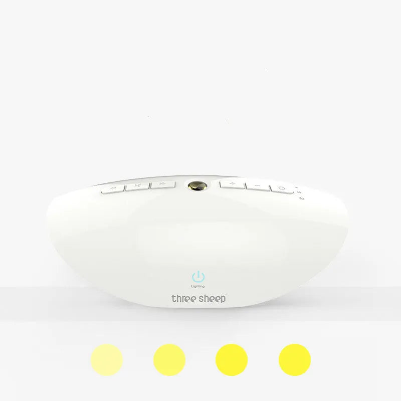 White plastic white noise sleep aid machine with mechanical buttons, 22cm tall.