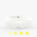 White plastic white noise sleep aid machine with mechanical buttons, 22cm tall.