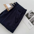 Man wearing beige loose straight-leg casual summer pants with a drawstring waist.