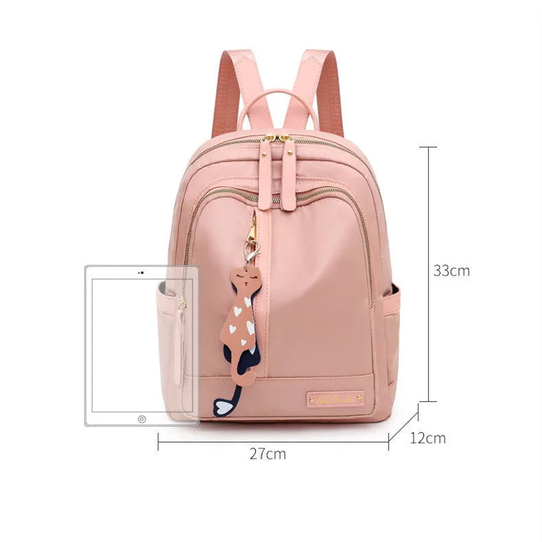 Black nylon women's casual backpack with internal pockets and double shoulder straps.