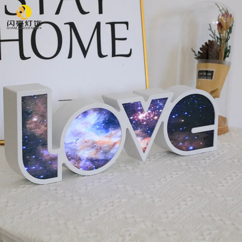Rainbow style LOVE word LED decorative light with USB cable, measuring 35.5cm by 13.5cm.