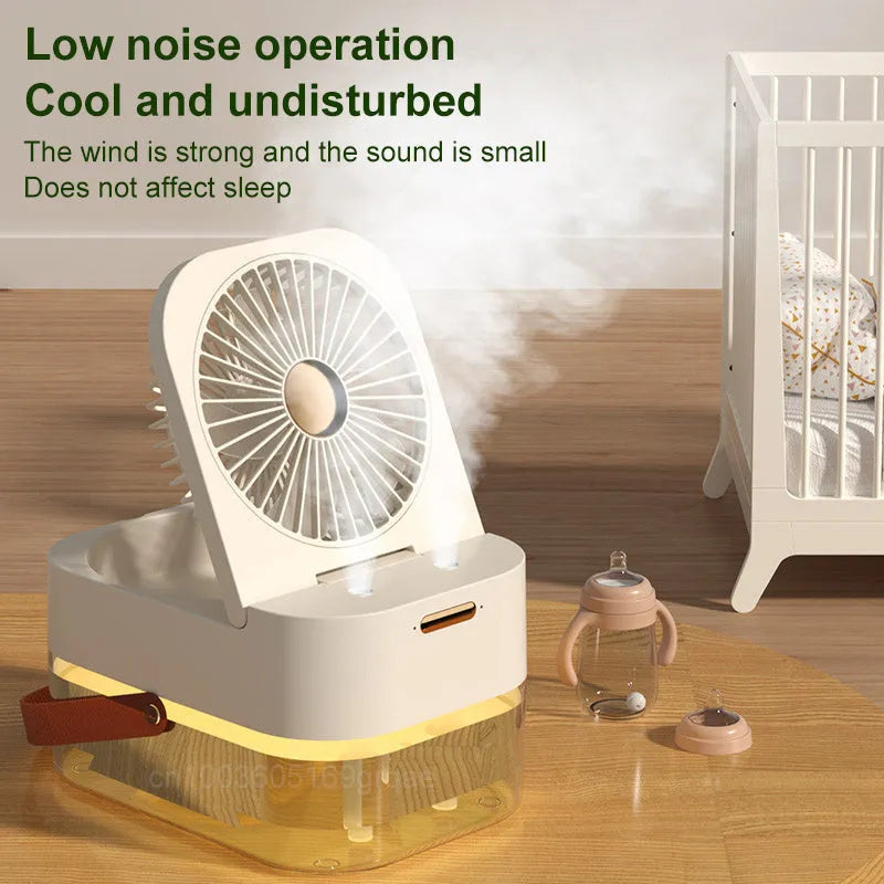Portable pearl white USB desktop humidifier fan with remote control on a wooden desk.