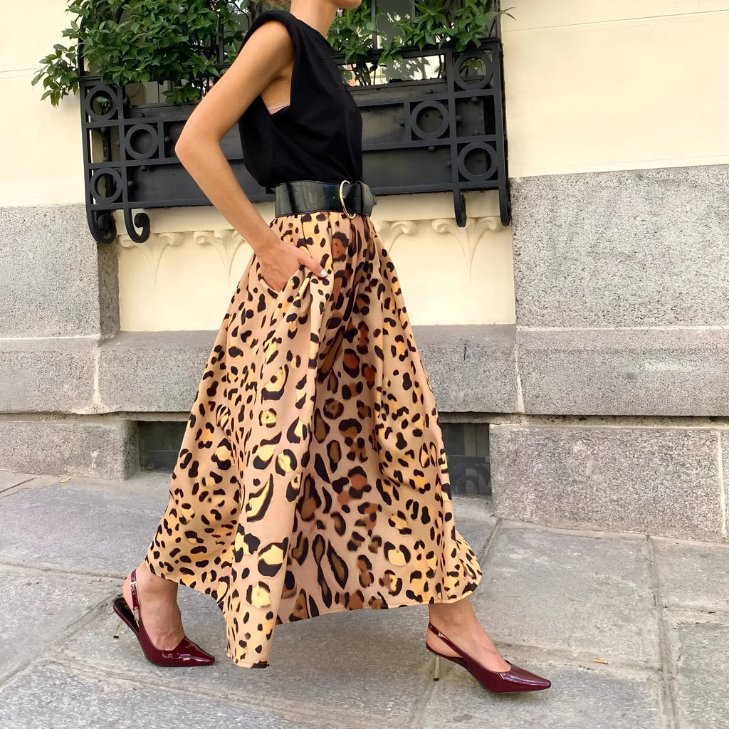 Brown leopard print women's A-line long skirt with a big hem on a model.