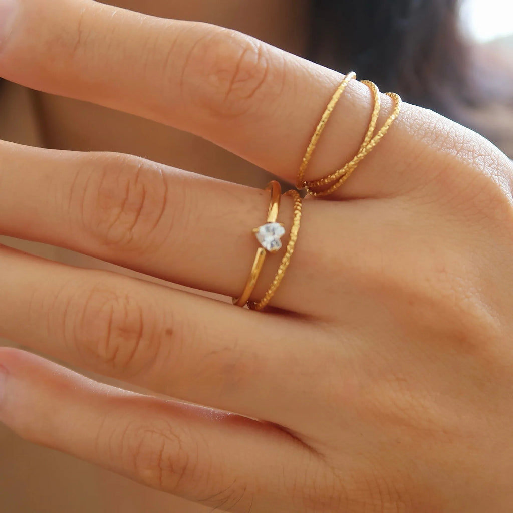 Golden stainless steel love heart or oval shaped simple bracelet ring for women in sizes 5 to 8