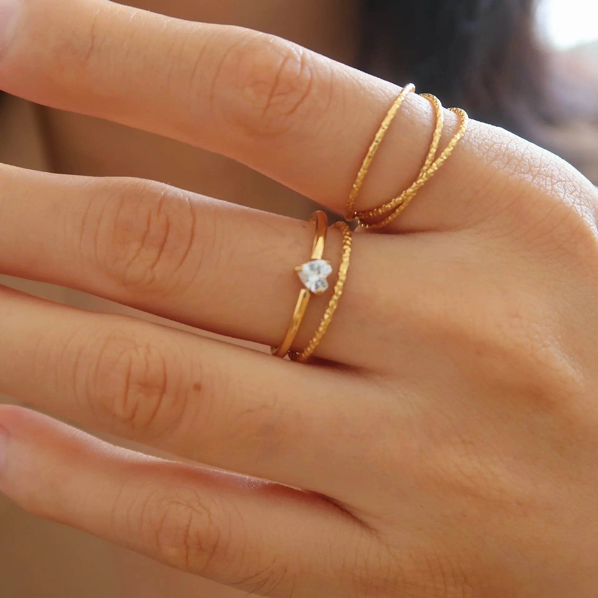 Golden stainless steel love heart or oval shaped simple bracelet ring for women in sizes 5 to 8