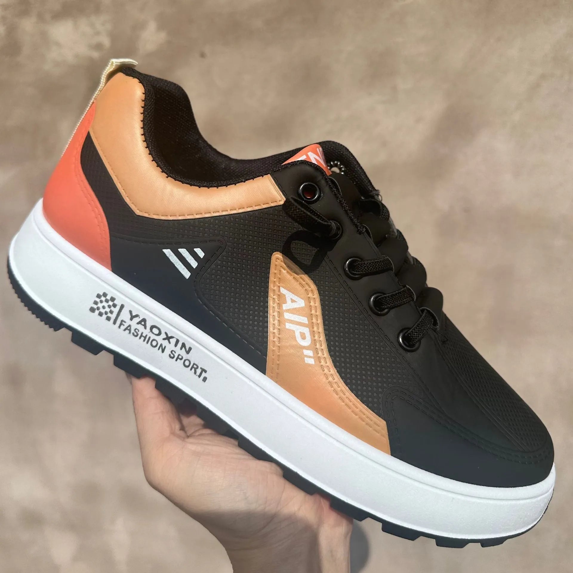 Men's white casual sports shoes with round toe and choice of orange, black, or brown accents on artificial PU upper.