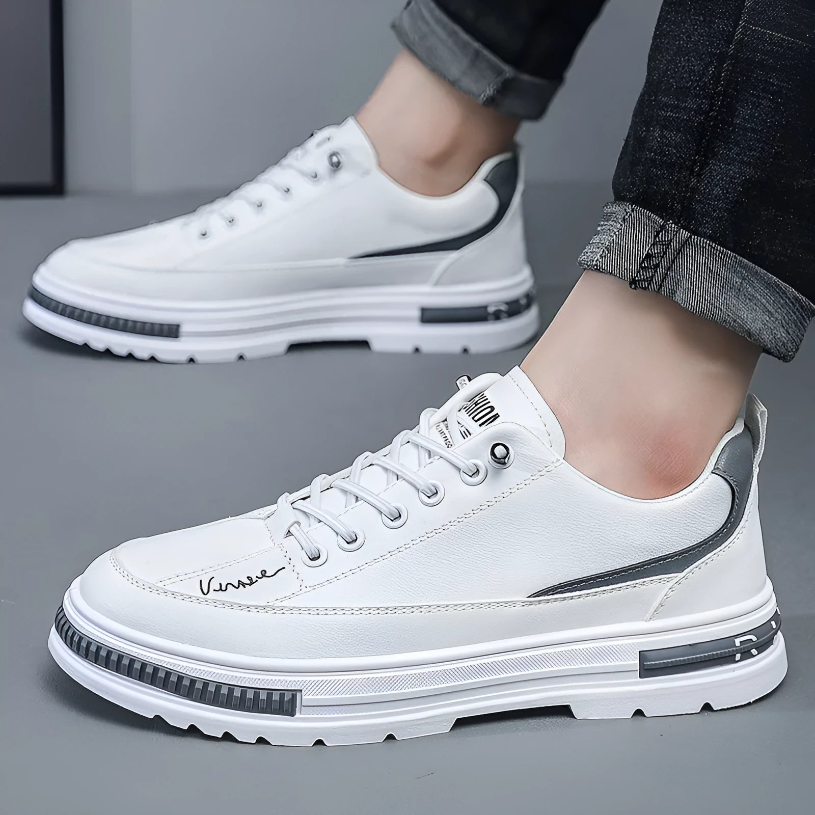 Men's white low-top platform sneakers with round toe and elastic band design on a plain background.