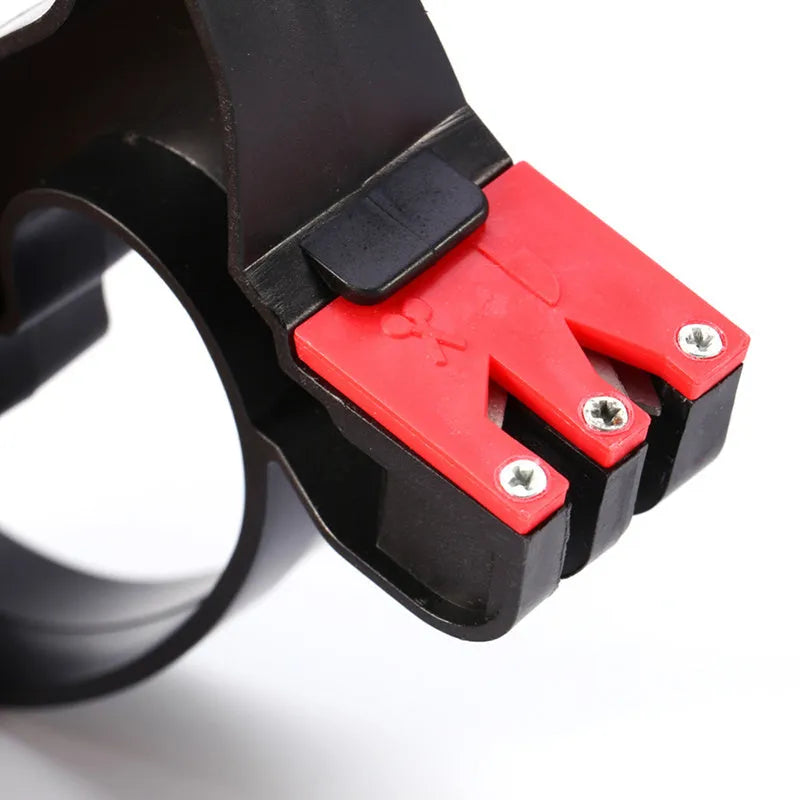 Black handheld knife and scissor sharpener showing ergonomic handle and sharpening slots on a white background.