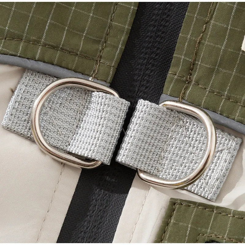 Khaki plaid and beige padded dog windbreaker with built-in leash ring and zipper pocket