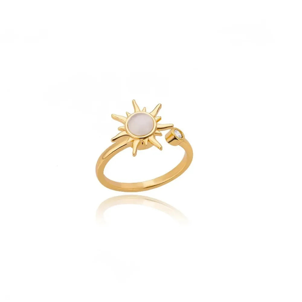 Adjustable rotatable decompression ring in gold finish with geometric design