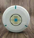 Black automatic sweeping robot cleaner on a wooden floor.