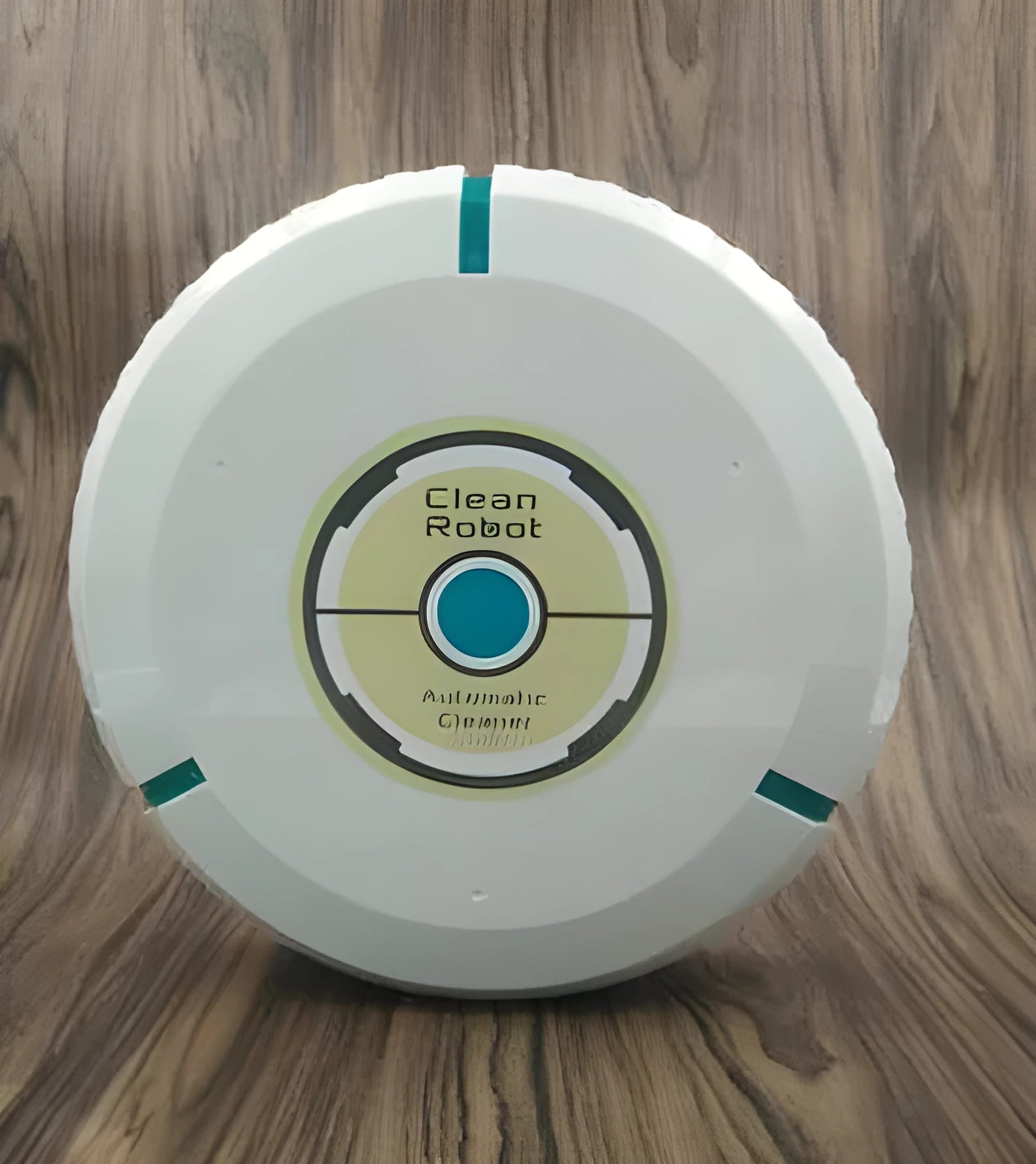 Black automatic sweeping robot cleaner on a wooden floor.
