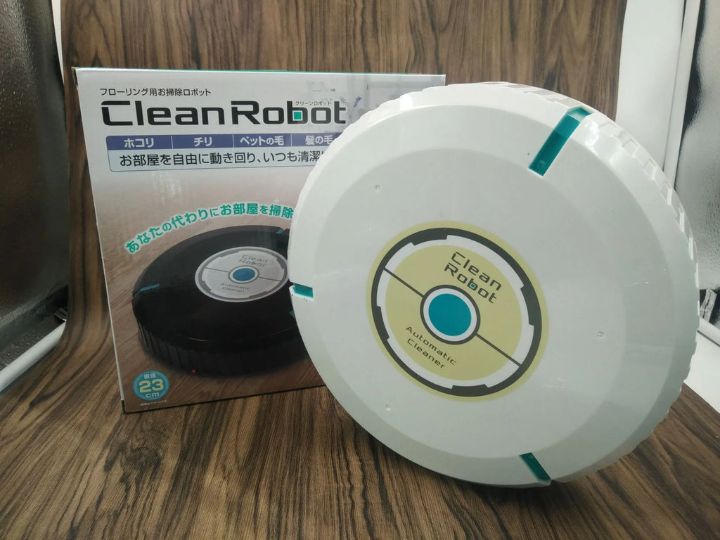 Black automatic sweeping robot cleaner on a wooden floor.