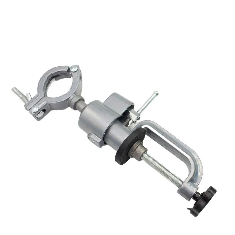 Clamp-on bench vise with a 360-degree rotating bracket and tungsten steel construction on a workbench.