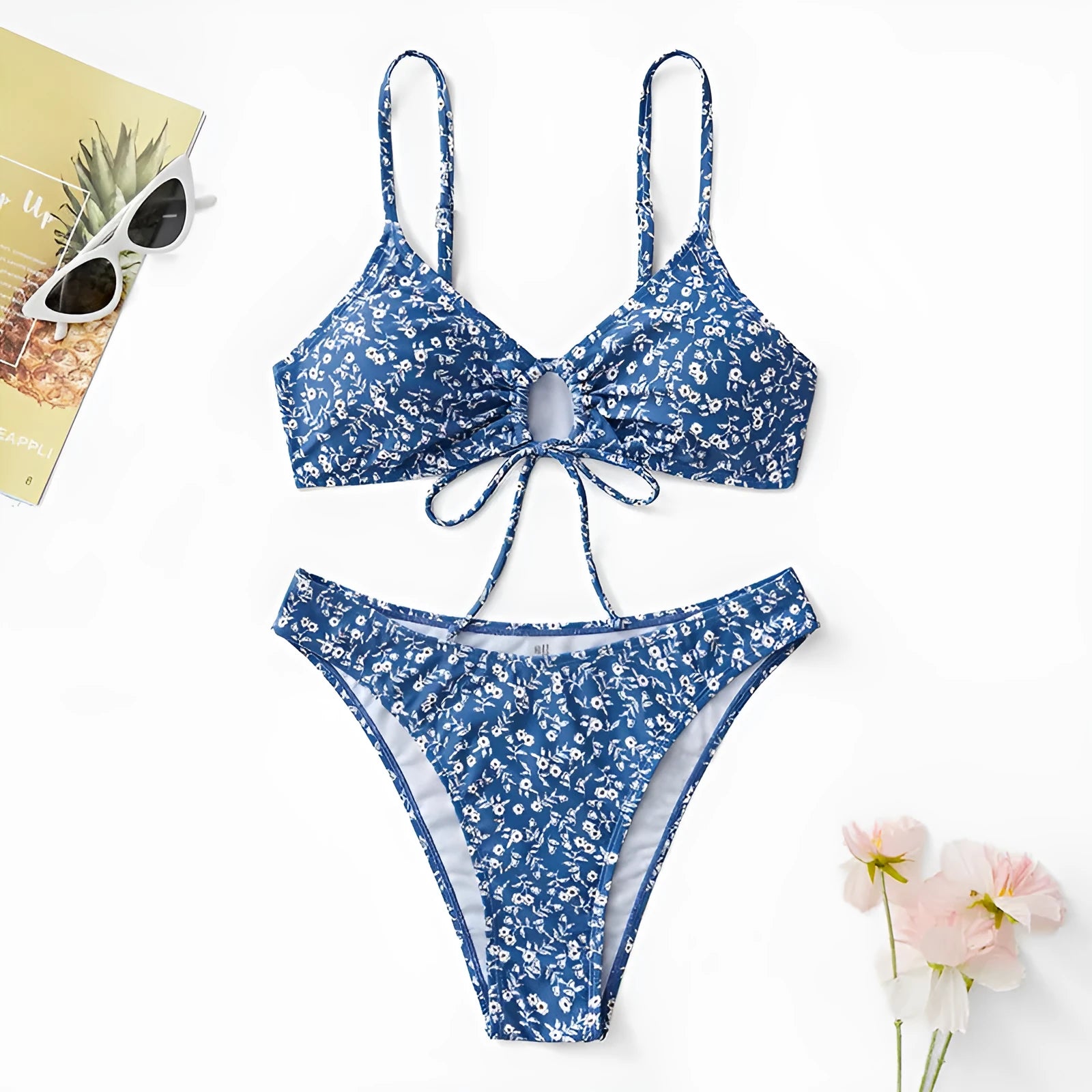 Blue women's swimsuit three-piece set with halter top and shorts on a mannequin.