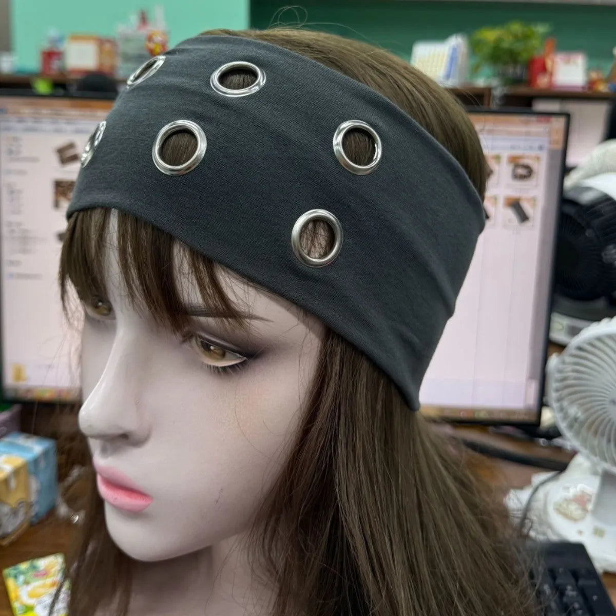 Hollow metal punk hair band with circle decoration in seven colour options on a white background.