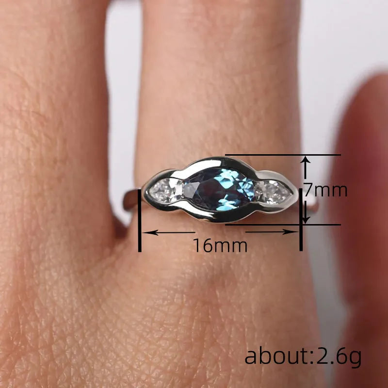 Women's geometric ellipse copper ring with inlaid zircon stone in white gold colour.