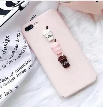 Soft pink TPU silicone iPhone case with a raised 3D cartoon cat design on the back.