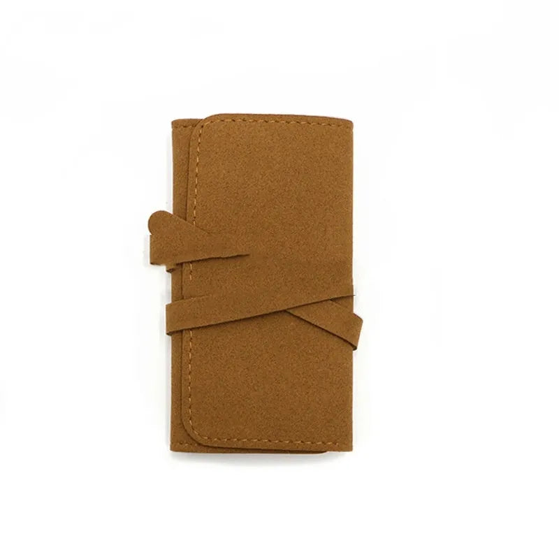Brown PU leather jewellery storage bag with microfiber lining, measuring 12cm by 12cm.