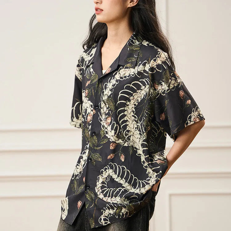 Short sleeve Cuban collar shirt with a snake bone and floral pattern in a loose fit.