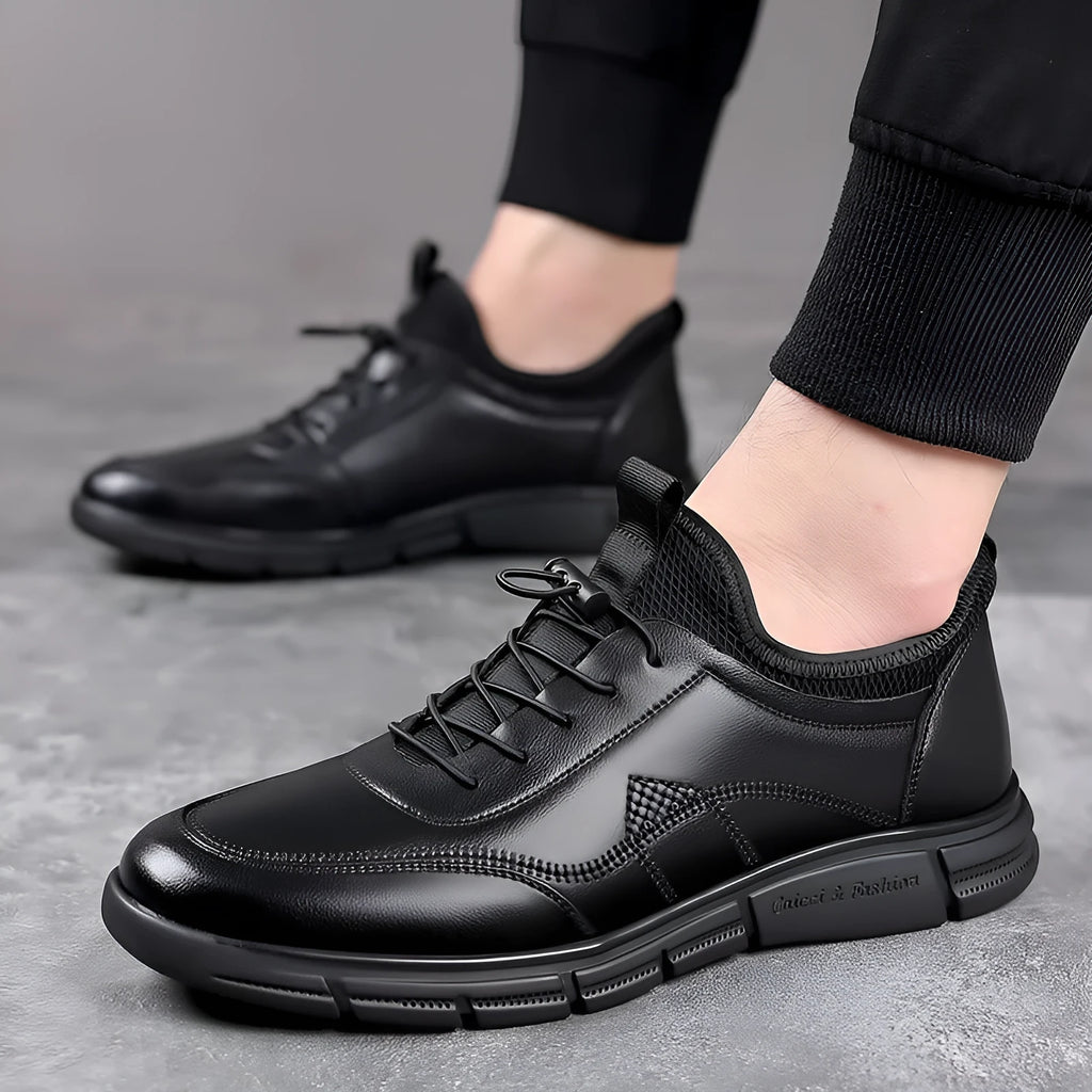 Black men's casual leather shoes with round toe and square low heel on a rubber sole.
