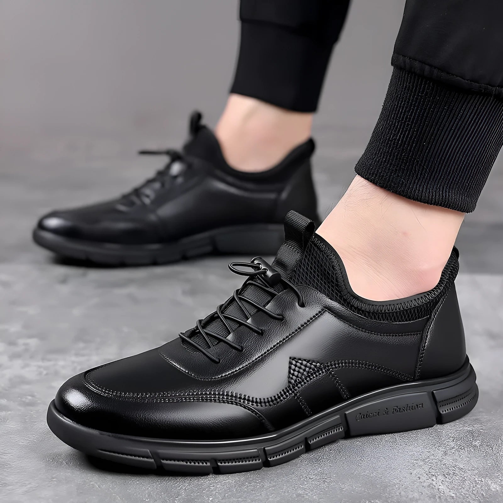 Black men's casual leather shoes with round toe and square low heel on a rubber sole.