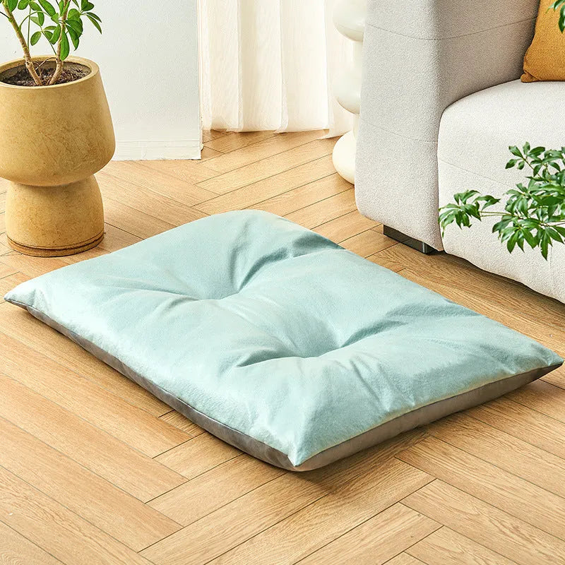 Cooling pet bed mat for cats and dogs in blue colour showing reversible fabric design
