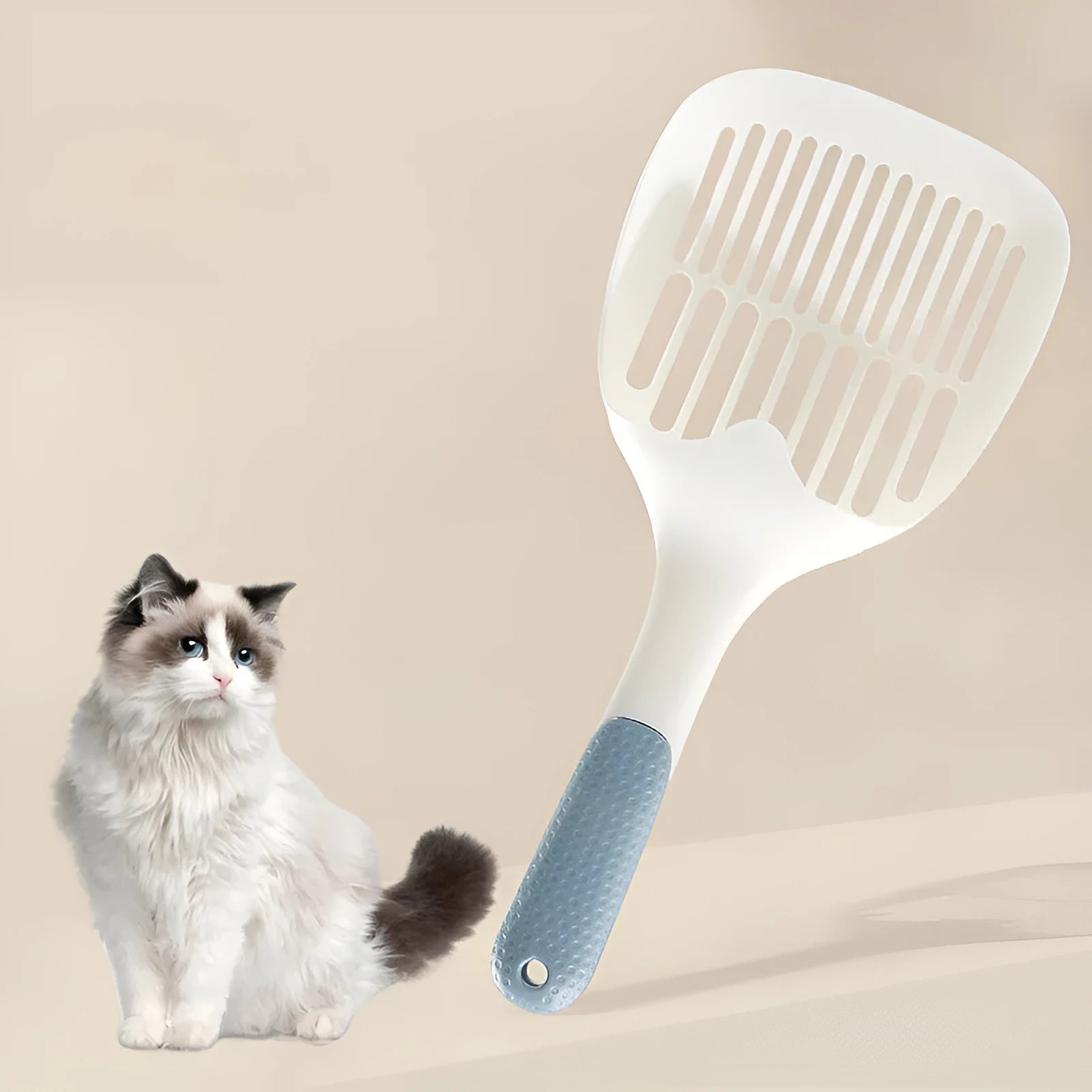Large white plastic cat litter shovel with angled handle on a grey background.