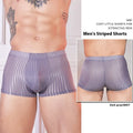 Men's striped low-rise underwear in thin transparent nylon, shown in black, dark grey, and white colours.