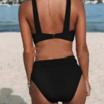 Women's solid colour polyester bikini set showing top and pants in black