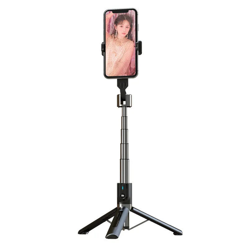 Black aluminium Bluetooth selfie stick with dual fill lights extended on a desktop.