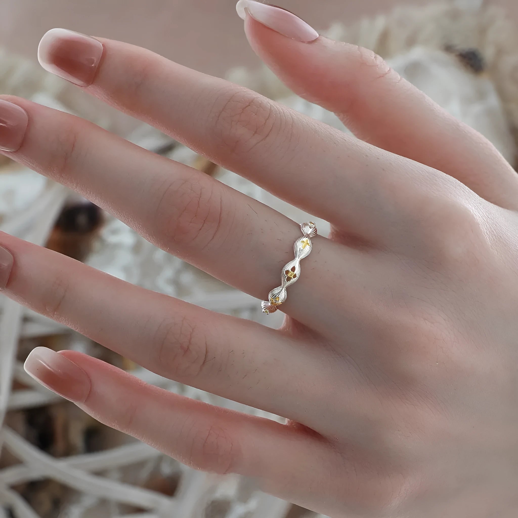 Buccherati brushed star ring in silver gold electroplated finish with adjustable opening on a white background