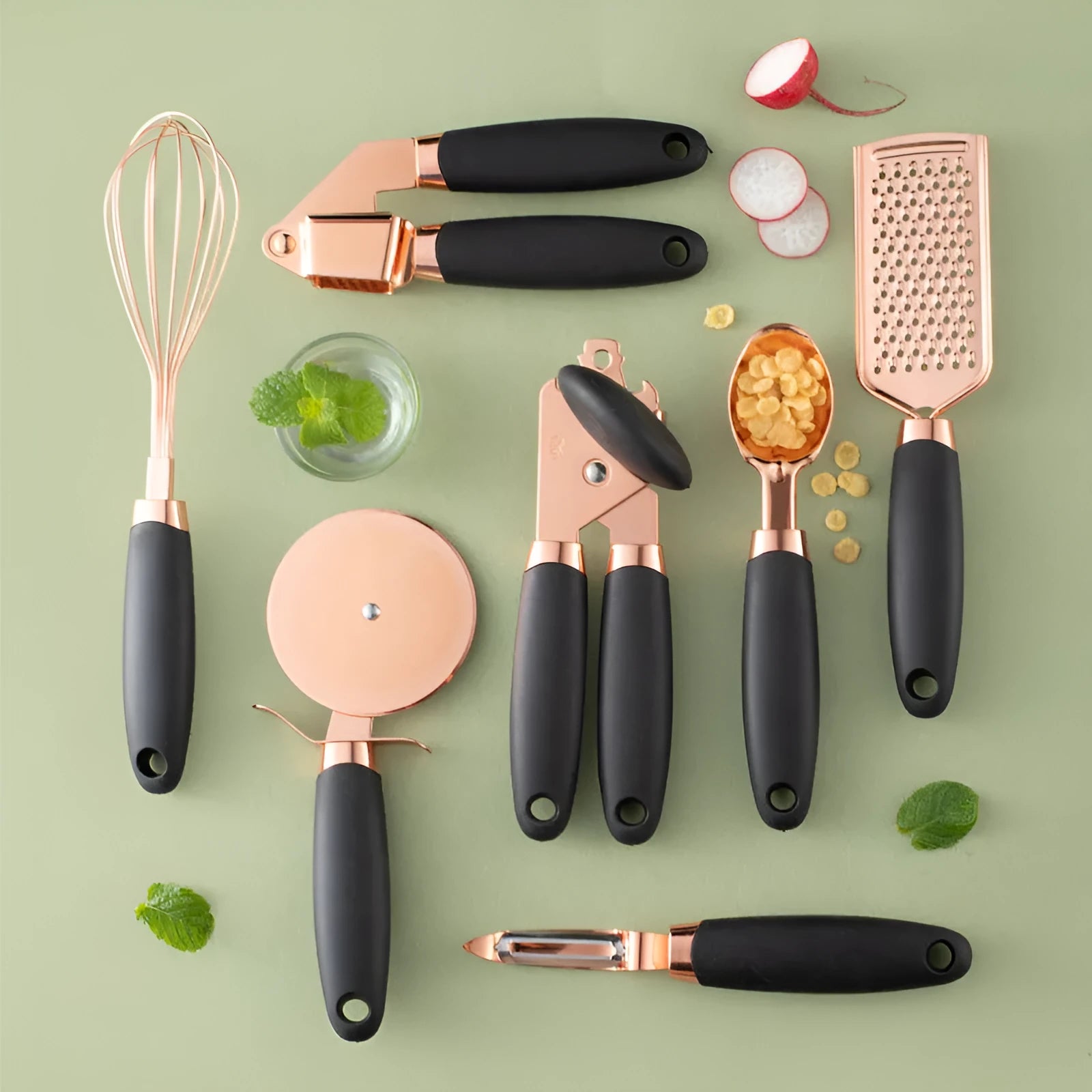 Seven-piece stainless steel kitchen utensil set with rose gold accents in six colour options on countertop