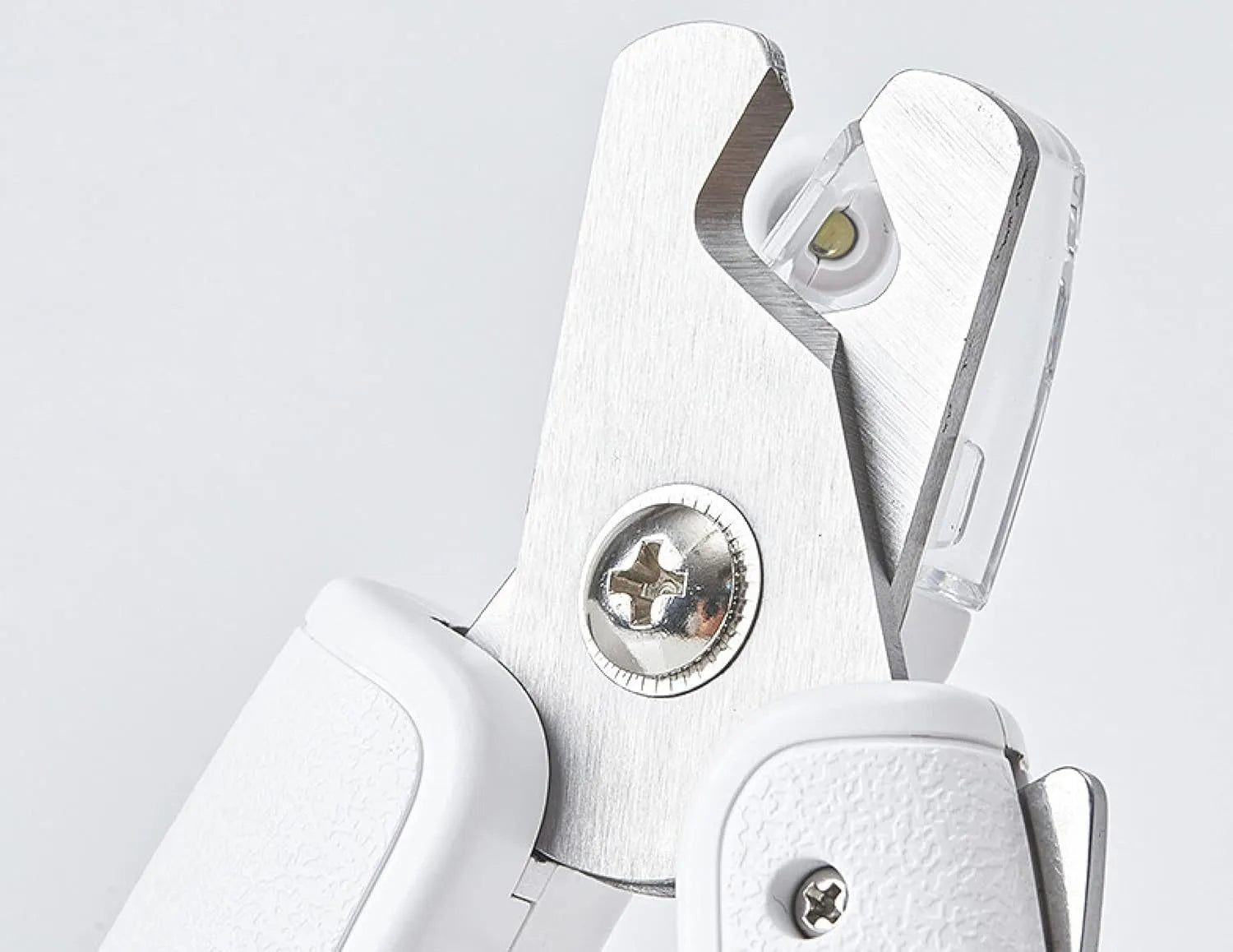 White pet nail clippers with LED light on the handle and a clear anti-splash guard covering the blades.