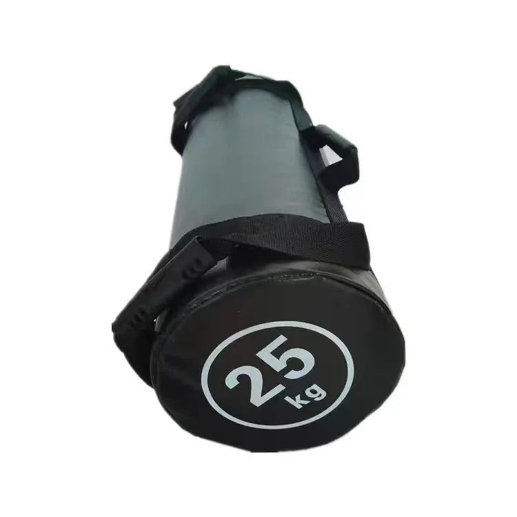 A flat white PVC power lifting sandbag for weight training on a gym floor.
