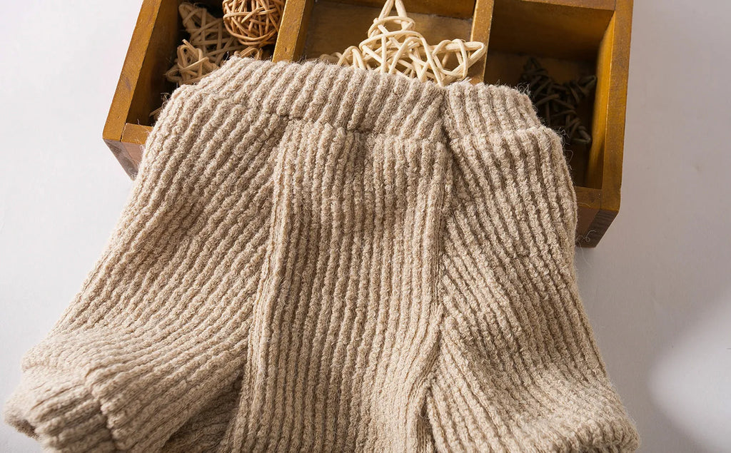 Brown cloth sweater pullover on a small dog, showing casual style and fit.
