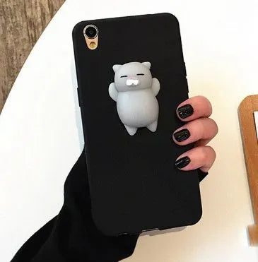 Soft pink TPU silicone iPhone case with a raised 3D cartoon cat design on the back.
