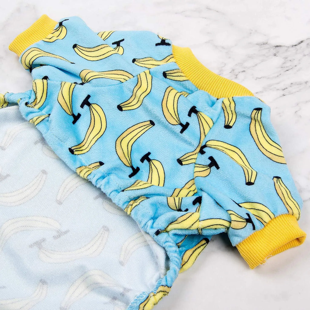 Polyester four-legs pet dog pajamas in Blue banana print, sizes XS to L, with cm measurements for collar, bust, and back length