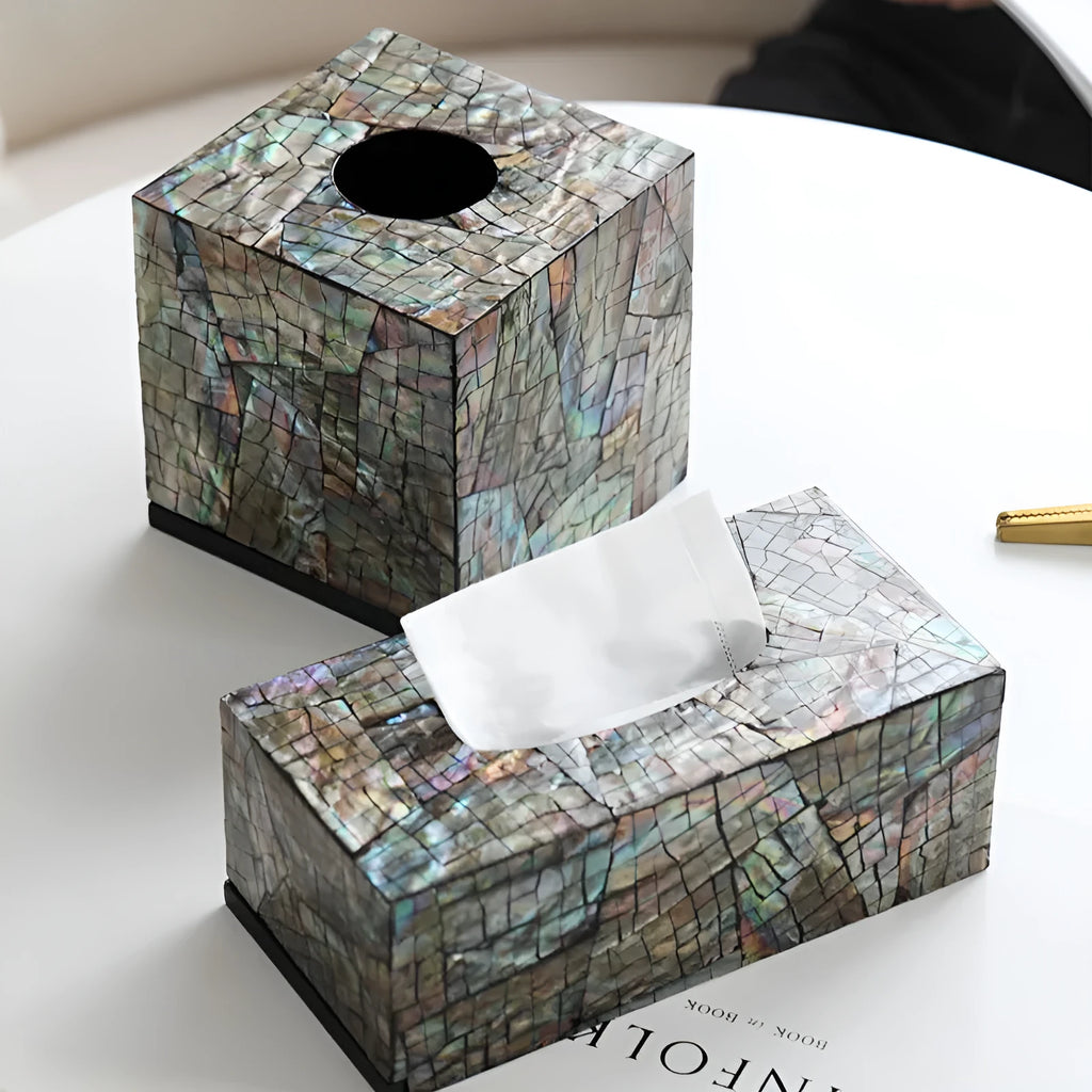 Natural shell decorative storage box in a minimalist design on a coffee table.