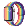 Silicone sports wristband with a single buckle clasp in black, white, and rainbow colours.