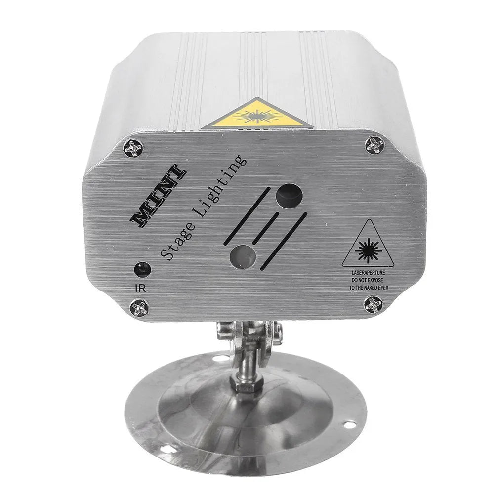 JC-24 dual laser light emitting red and green patterns against a dark indoor background with voice control remote included