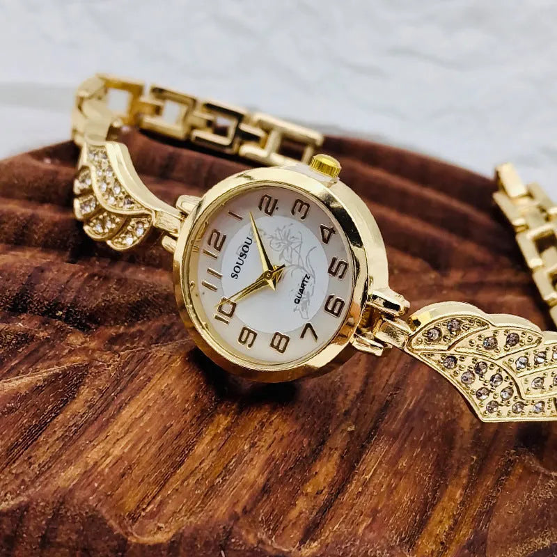 Women's round stainless steel watch with a choice of gold, golden white, or golden black dial on a steel strap with vachette clasp.