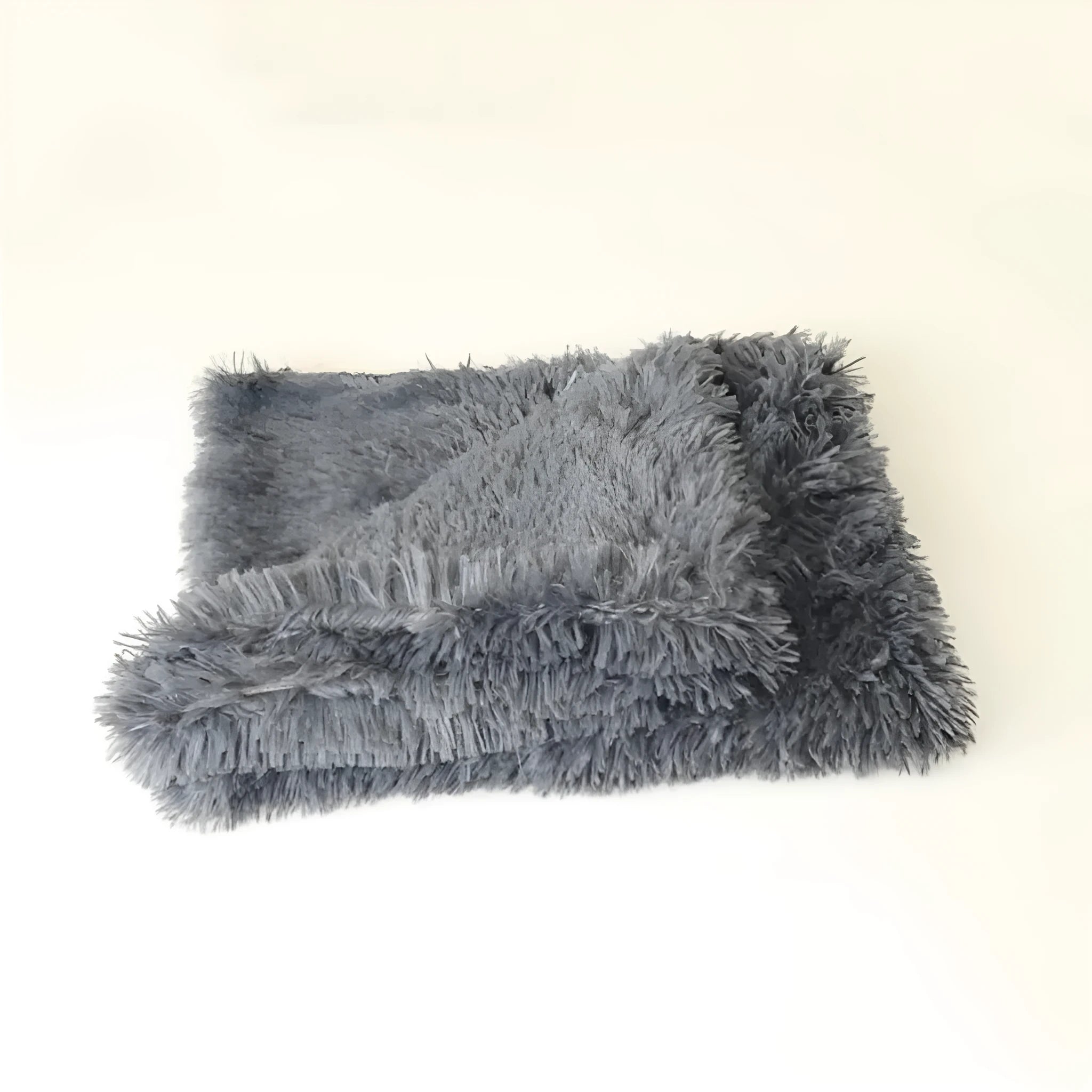 Double plush cat blanket in khaki colour resting on a sofa with soft texture for winter warmth