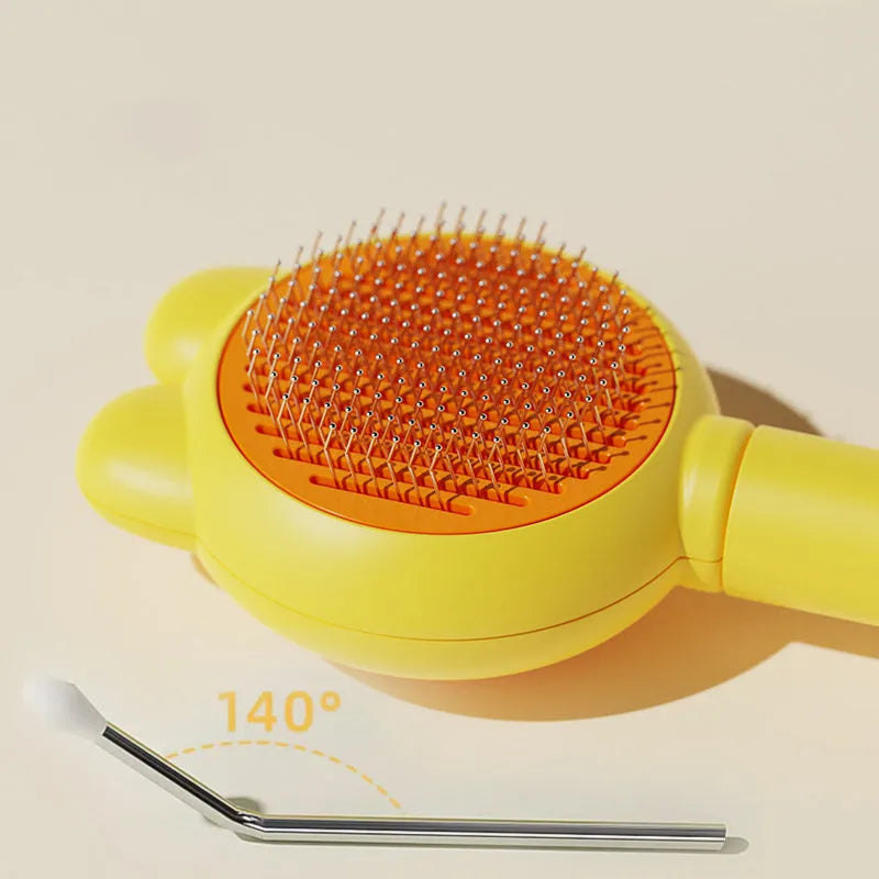 Green self-cleaning cat brush with release button and metal comb for pet grooming