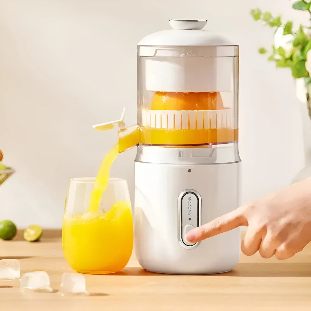 Fresh green wireless portable electric juicer with USB charging cable on a kitchen counter.