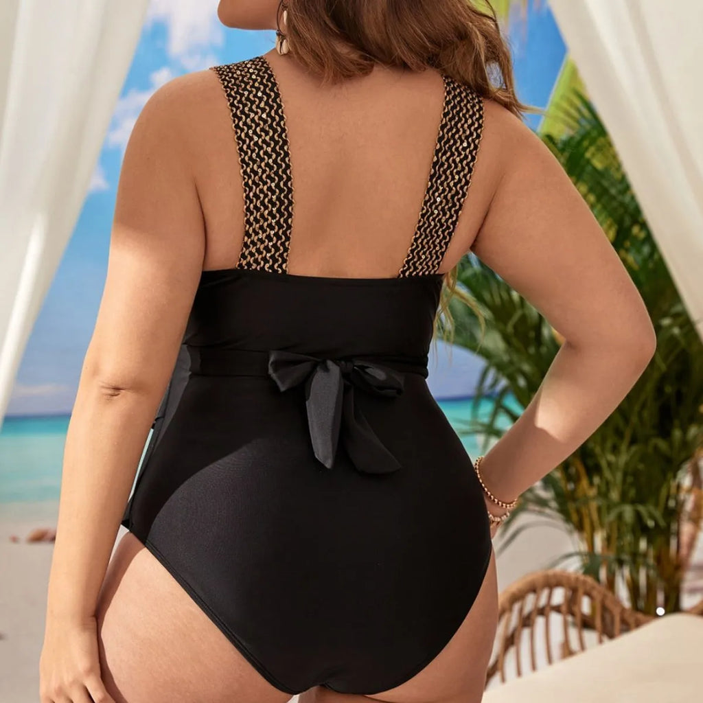 Plus size women's black one-piece swimsuit with built-in chest pads for swimming