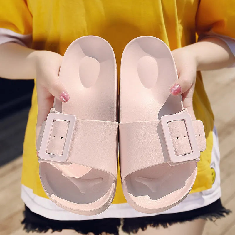 Women's grey blue buckle strap sandals with a soft EVA sole on a light background.